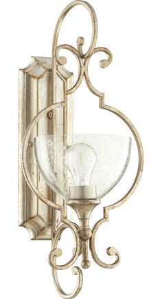 a light fixture with an ornate design on the front and back of it's arm