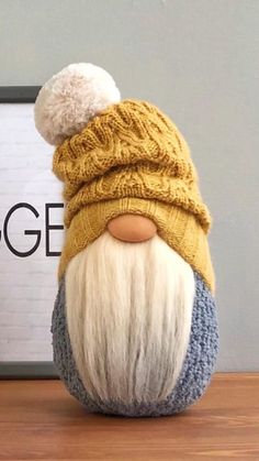 an old man wearing a knitted hat with a white beard and long blonde hair