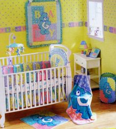 there is a baby crib in the room with toys on the floor and walls