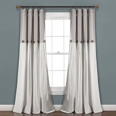 the curtains in this room are white and grey with brown trimmings on them