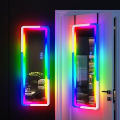 the door is open and there are neon lights on it's sides, along with an illuminated mirror