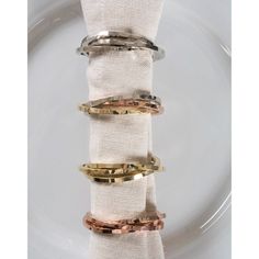 three different types of napkin rings on a plate