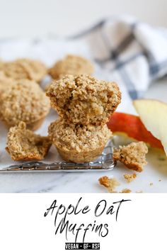 apple oat muffins on a fork with an apple in the background and text overlay