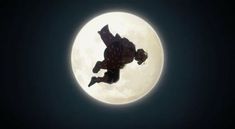 a man flying through the air in front of a full moon