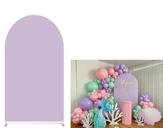 an arch with balloons and mermaid decorations on it, next to a backdrop for a baby's first birthday