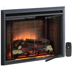 an electric fireplace with fire logs and remote control