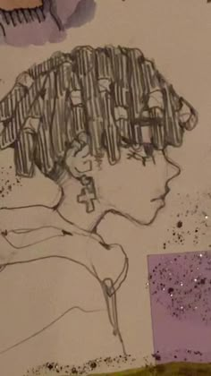 a drawing of a woman's head on a piece of paper with glitters