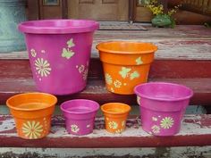 colorful flower pots are sitting on the steps