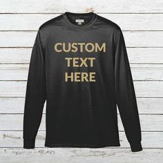 Add Your Own Text - Custom Personalized Wicking T-Shirt Polyester Long Sleeve Tee for Men Put any text you want onto a long sleeve polyester wicking tee shirt with the text color of your choice. Please make sure to look through all the photos for the options we have available. Make sure to include your custom options in the Add Your Personalization section before adding the item to your cart. - 100% polyester wicking knit - Self-fabric collar, double-needle cover-stitched collar and armholes - S Long Sleeve Moisture-wicking T-shirt For Sports, Customizable Long Sleeve Sports T-shirt, Black Long Sleeve Sports T-shirt, Black Long Sleeve T-shirt For Sports Events, Custom Text Long Sleeve Tops For Streetwear, Customizable Black Top With Text, Black Long Sleeve T-shirt With Custom Text, Customizable Black Long Sleeve T-shirt, Customizable Black Long Sleeve Tops