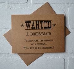 a piece of paper with the words wanted written in black ink on it, hanging from a brick wall