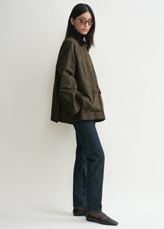 Oversized TOTEME jacket made from waxed cotton sourced from British heritage weavers and dyed in a dark shade of forest green. It’s designed with a very spacious A-line silhouette accented with a brown corduroy collar and elbow patches, a zipper and press-stud front, flap and welt pockets, and two back vents. Wear it as intended or take a smaller size for a more true-to-size look. Waxed Jacket Outfit, Dark Style Outfits, Toteme Jacket, A Line Jacket, Carpenter Jacket, Forest Fashion, Autumn Jacket, Polished Casual, Designer Jacket