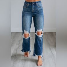 Dark Wash Straight Crop Jeans Intentional Distressing Fading/Whiskering Button/Fly Closure Raw Edge Frayed Hems Good Stretch High Rise 10.5” Straight Jean Fit Cropped Length Rise: 10.5" Inseam: 26.5" 94.5% Cotton, 4% Polyester, And 1.5% Spandex Tag Fits: 1/25 (Size2) 3/26 (Size 4) 5/27 (Size 6) 7/28 (Size 8) 9/29 (Size 10) 11/30 (Size 12) 13/31 (Size 14) 15/32 (Fits Size 16) Risen Jeans, Black Flared Jeans, Womens Distressed Jeans, Country Clothes, Black Flare Jeans, Jean Fit, Dark Wash Flare Jeans, High Rise Straight Leg Jeans, Retro Pants