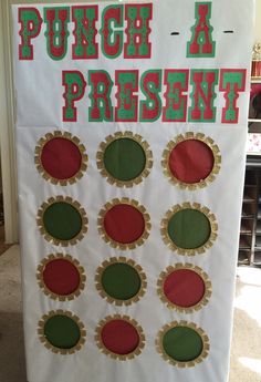 a sign that says punch a present with different colors and shapes on it, sitting in front of a door