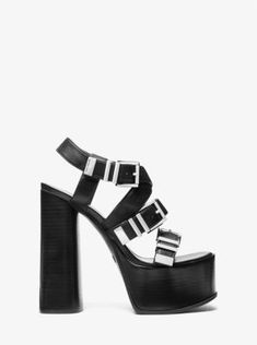 The Darrington sandal encapsulates the season’s downtown-chic aesthetic. Made from leather with silver-tone hardware, this vertiginous pair rests on a stacked platform heel with buckled straps. Wear yours to late-night parties and events. Black Platform Sandals In Synthetic Material, Black Edgy Platform Sandals, Black Chunky Platform Sandals In Synthetic, Edgy Knee-high Platform Heels, Black Chunky Platform Synthetic Sandals, Night Parties, Chic Aesthetic, Leather Platform Sandals, Platform Heel