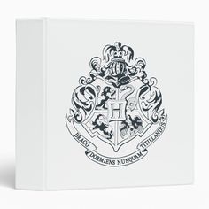 the hogwarts crest is shown on a white mousepad with black lettering and an ornate