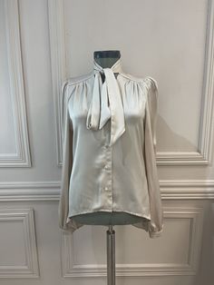 The shirt is made out of satin material and has lovely little satin buttons and a beautiful tie to make a bow around the neck. It is really elegant, very chic. Blouse Classy, Feminine Top, Elegant Blouses, Satin Shirt, Satin Material, How To Make Bows, Wool Coat, Bulgaria, Womens Clothing Tops