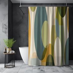 a bathroom with a bathtub and shower curtain that has an abstract design on it