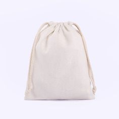 a white bag with rope handles on a white background