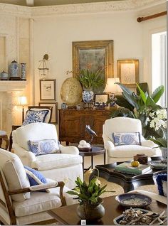 the living room is decorated in blue and white