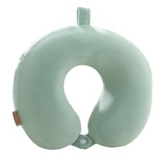 a green neck pillow sitting on top of a white surface