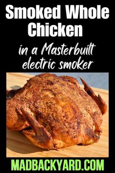 smoked whole chicken in a masterbuil electric smoker on a wooden cutting board