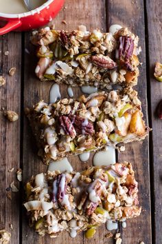 granola bars with nuts and milk on a wooden table