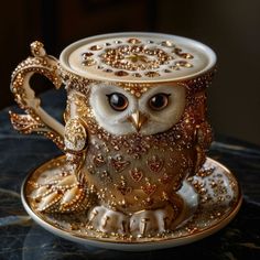 an owl figurine sitting on top of a cup and saucer with beads