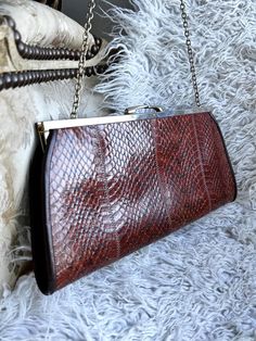 This listing is for a very nice vintage  leather bag in  vintage condition with gold tone clasp  ,  this bag is in excellent vintage condition  , could be used without any problem Quantity : 1    Dimensions : 30cm x 13cm x 2.4cm ,   40cm chain,    /   12" x 5.2" x 1"   Material of item : leather  Thank you very much for your visit , your mail will be sent by simple mail from France within 3 business days (if you need a registered mail please contact me in advance) , All mail take about 20 days t Vintage Brown Satchel Clutch, Vintage Brown Evening Bag For Party, Vintage Rectangular Leather Evening Bag, Vintage Leather Rectangular Evening Bag, Vintage Brown Bag With Chain Strap, Vintage Formal Bags With Gold Clasp, Vintage Brown Rectangular Evening Bag, Red Vintage Shoulder Bag With Gold-tone Hardware, Vintage Burgundy Formal Bag