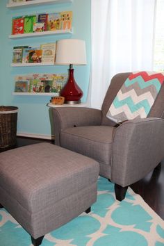 a gray chair and ottoman in a room