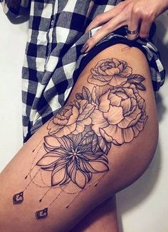 a woman's thigh with flowers on it