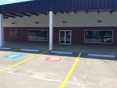 an empty parking lot in front of a building