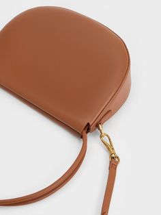 This product is made with at least 20% sustainable materials by weight. CHARLES & KEITH uses recycled, degradable, organic, and water-based materials in our eco-conscious collection. Looking for an alternative to the colour black that is just as chic and versatile? Tan brown is the answer. The simplicity of the Elora curved top handle bag lets the rich and elegant hue shine, making it a striking focal point of any outfit. Pair it with lighter neutral tones to create an eye-catching contrast that will make your entire ensemble stand out. Additionally, the Elora comes with a detachable strap that allows you to play around with styling the bag. Size Chart For Kids, Charts For Kids, Charles Keith, Printables Kids, Eco Conscious, Sustainable Materials, Handle Bag, Neutral Tones, Belt Size