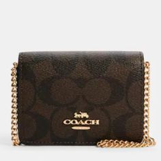 Coach - Signature Canvas Mini Wallet With Chain (Nwt) Color - Black And Brown Signature Coated Canvas And Smooth Leather Two Credit Card Slots Snap Closure Fabric Lining Outside Open Pocket Detachable Chain Strap Approximate Size - 4" (L) X 3" (H) X 1" (W) Smoke And Pet Free Home Wallet With Chain, Signature Canvas, Mini Wallet, Wallet Chain, Chain Strap, Coach Bags, Smooth Leather, Snap Closure, Card Slots