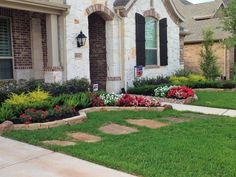 a house with landscaping in front of it