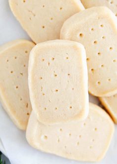 several pieces of shortbread sitting on top of a white plate