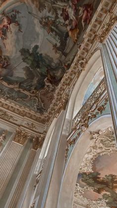 an ornate ceiling with paintings on it