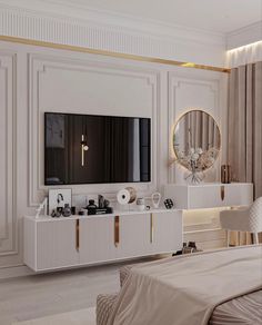 an elegant bedroom with white furniture and gold accents, including a large mirror on the wall