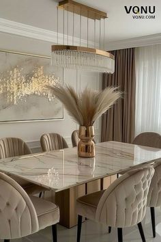 a dining room table with chairs and a chandelier