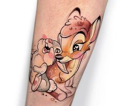 a tattoo with an image of a dog and a deer on it's leg