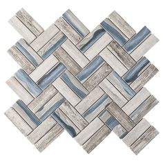 a white and blue mosaic tile pattern on the wall with wood grained tiles in grey tones