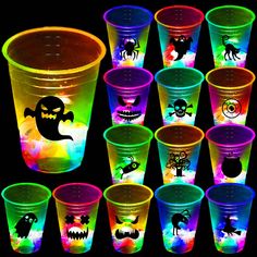 there are many plastic cups that have different designs on them and glow in the dark