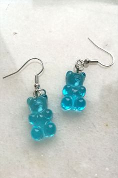 Cute and sweet gummy bear earrings. Not only for Haribo bears lovers. Full of colors A pair of plastic gummy bear earrings available in blue, yellow, pink, purple, red, orange or transparent. Very lightweight and perfect for both adults and kids. Different colors to show all styles and express every personality. #gummybear #gummybearearrings #pinkearrings #orangeearrings #funnyearrings #sweetearrings Cute Clear Jewelry For Party, Cute Clear Party Jewelry, Cute Clear Dangle Earrings, Fun Clear Jewelry As Gift, Fun Clear Jewelry For Gifts, Fun Clear Jewelry As A Gift, Cute Hypoallergenic Clear Jewelry, Cute Gummy Bear, Crazy Earrings