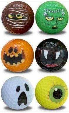 six different colored balls with faces and eyes on them, all decorated like pumpkins