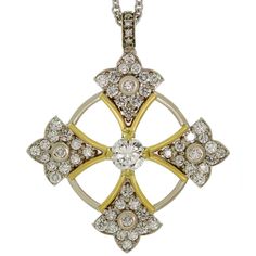 This gorgeous modern Balestra necklace features a Patonce Cross Pendant crafted in 14k white & yellow gold and set with an estimated 0.88 carat diamond in the center F-G color, SI-I clarity, surrounded with an estimated 1.70 carats of diamonds in the pendant and an estimated 1.09 carats in the chain. G-H color. VS1 -VS2 Made in United States circa 2000s. Measurements: 1.37" (35mm) x 1.65" (42mm) pendant, 34" (86cm) length. Cross Jewelry, Cross Pendant Necklace, Cross Pendant, Diamond White, Jewelry Stores, Yellow White, Jewelry Necklace Pendant, Jewelry Necklaces, Diamonds