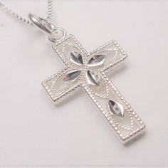 Sterling Silver Holy Cross Decorative Silhouette Pendant Necklace This Beautiful Holy Cross Decorative Silhouette Sterling Silver Necklace Comes With A .925 Sterling Silver 20 Inch Chain And The Holy Cross .925 Sterling Silver Pendant. The Pendant Measures 1 Inch High And 5/8 Inches Wide. The Chain Measures 20 Inches And Weighs 2.2g. Cn 1-0295 Silver Diamond Cut Cross Pendant Necklace, Silver Cross Pendant Necklace With Sterling Silver Clasp, Silver Cross Necklace With Sterling Clasp, Silver Cross Necklace With Sterling Silver Clasp, Silver Cross Jewelry With Diamond Cut, Silver Cross Necklace With Diamond Cut, Sterling Silver Diamond Cut Pendant Cross Necklace, Silver Diamond Cut Pendant Cross Necklace, Silver Diamond Cut Cross Jewelry