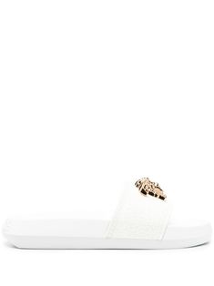 white Medusa plaque detail signature Greca detailing embossed logo to the rear open toe slip-on style moulded footbed flat rubber sole White Textured Sole Slip-on Slides, Luxury White Slip-on Slides, Versace Slides, Slides Shoes, Embossed Logo, Slide Slipper, Open Toe, Rubber Sole, Versace