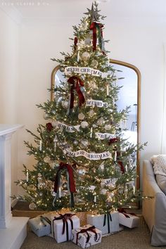 a decorated christmas tree with presents under it