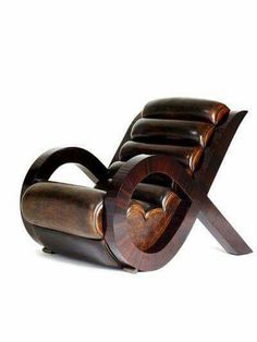 a chair made out of wood and leather with a heart shaped seat on the back