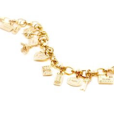 This deluxe solid gold bundle features 12 mini solid gold charms* on the classic slim solid gold infinity link charm bracelet. VIEW THE COLLECTION HERE Included in 14k solid gold: *12 solid gold mini charms (valued at $148 each only) Slim solid gold infinity link charm bracelet (14 links, approximate dimensions: 7") Handmade Charm Bracelets Gold, Ring Charm Necklace, Pearl Charm Bracelet, Solid Gold Charms, Solid Gold Bracelet, Travel Charms, Gold Charms, Gold Charm Bracelet, Mini Charm