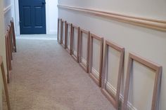 an empty hallway leading to a blue door